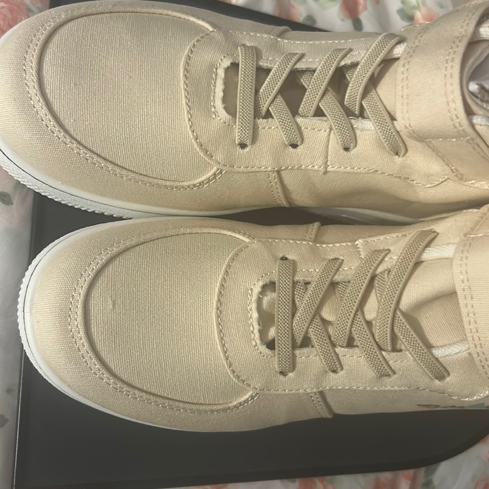 selling tan  Stego bones high top sneakers.